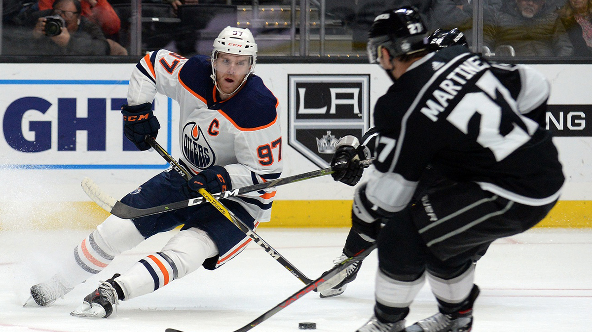 Edmonton Oilers center Connor McDavid (97) moves the puck against Los Angeles Kings defenseman Alec Martinez (27) during the third period at Staples Center.