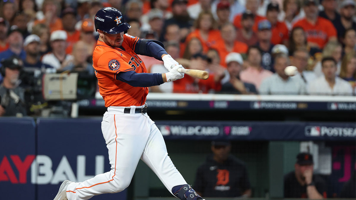 Oct 2, 2024; Houston, Texas, USA; Houston Astros third base Alex Bregman (2) hits a single against the Detroit Tigers during the second inning of game two of the Wildcard round for the 2024 MLB Playoffs at Minute Maid Park.