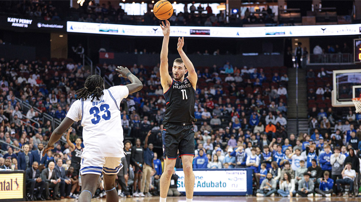 Connecticut Huskies forward Alex Karaban (11) shoots the ball as Seton Hall Pirates guard Garwey Dual (33) defends during the first half at Prudential Center