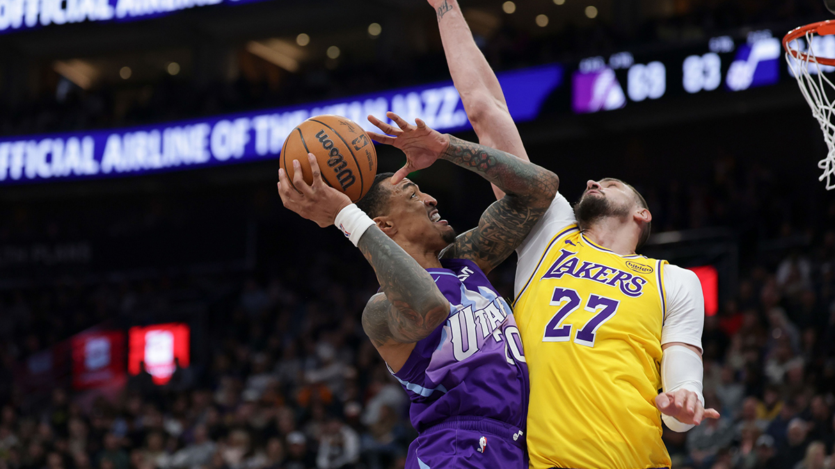 Utah Jazz striker John Collins (20), against the center of Los Angeles Lakers Alex Len (27) during the second half at the Delta Center. 