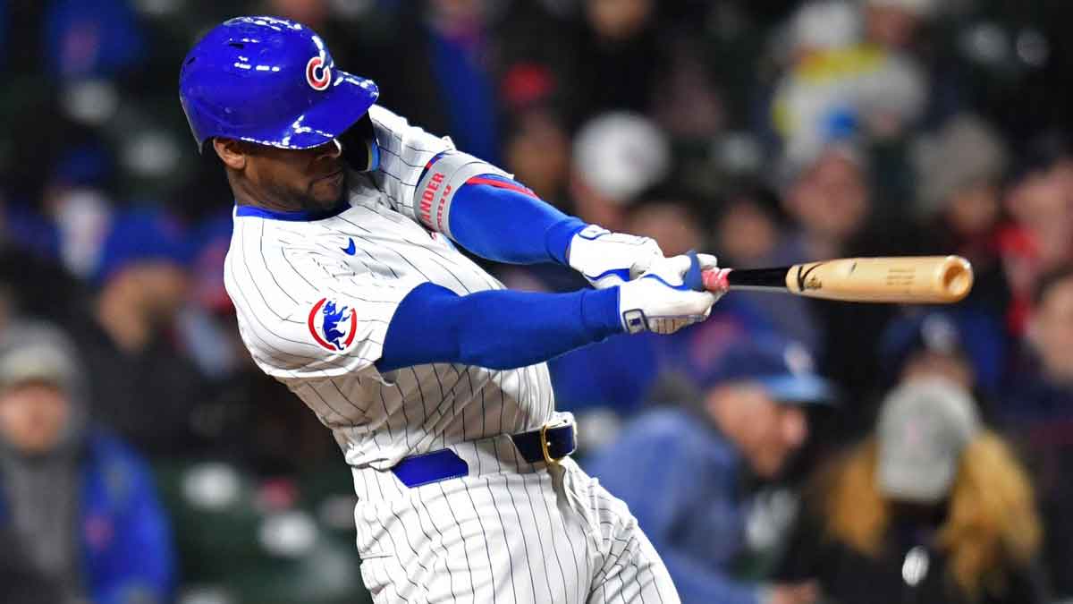 Apr 20, 2024; Chicago, Illinois, USA; Chicago Cubs outfielder Alexander Canario (4) hits a home run during the sixth inning against the Miami Marlins at Wrigley Field. 