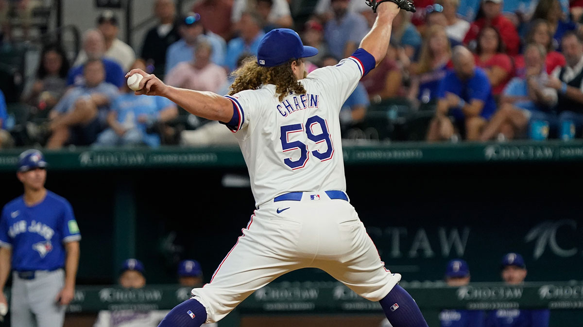 Sep 19, 2024; Arlington, Texas, USA; Texas Rangers pitcher Andrew Chafin (59) throws to the plate during the eighth inning against the Toronto Blue Jays at Globe Life Field. 