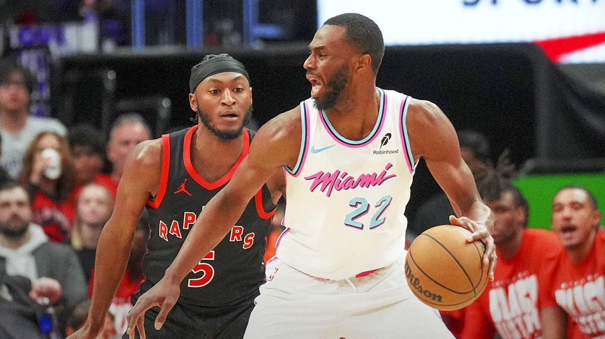 Miami Heat forward Andrew Wiggins (22) moves the ball against Toronto Raptors guard Immanuel Quickley (5) during the second half at Scotiabank Arena. 