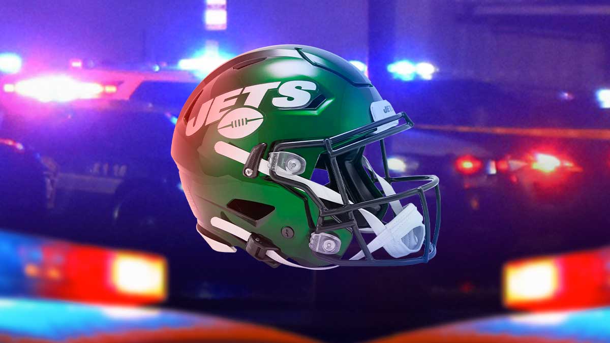 New York Jets helmet with red and blue police lights behind it after jets player robbed in burglary.