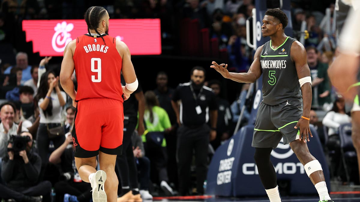 The Minnesota Timberwolves goalkeeper, Anthony Edwards (5), celebrates his three -point basket towards Houston Rockets Dillon Brooks (9) in the fourth quarter at the Target Center.