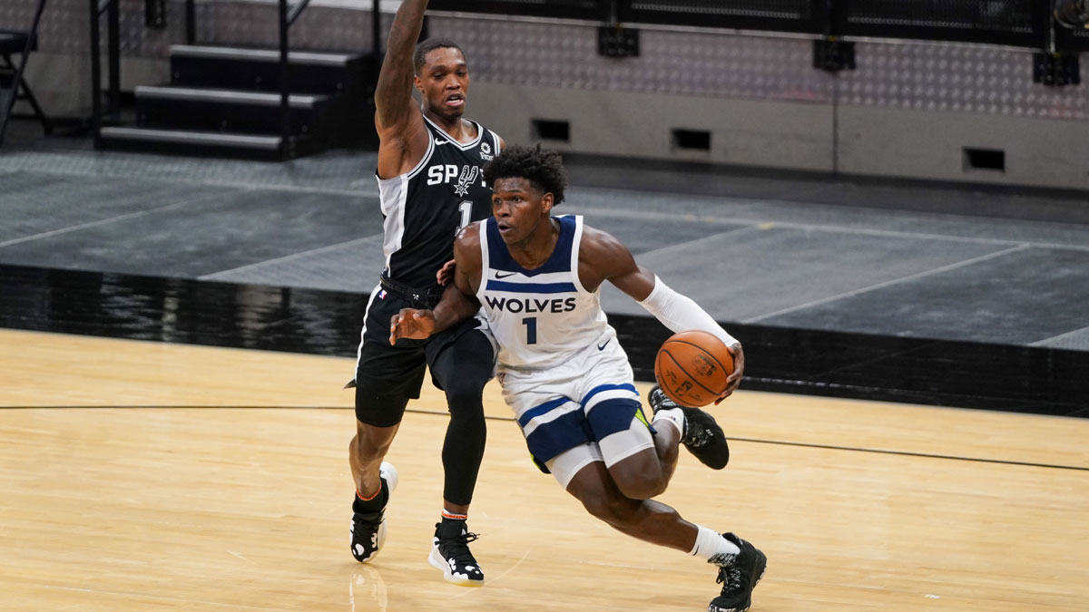 Minnesota Timbervolves Guard Anthoni Edwards (1) Dribbles Next to San Antonio Spurs Guard Lonnie Walker IV (1) In the second half in the center of AT & T. 