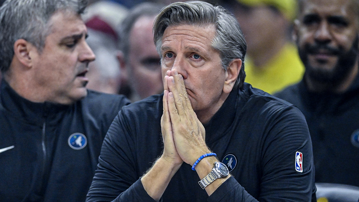 Minnesota Timbervolves Chief Coach Chris Finch sits on a bench in the first quarter against Cleveland Cavaliers on a missile mortgage field.