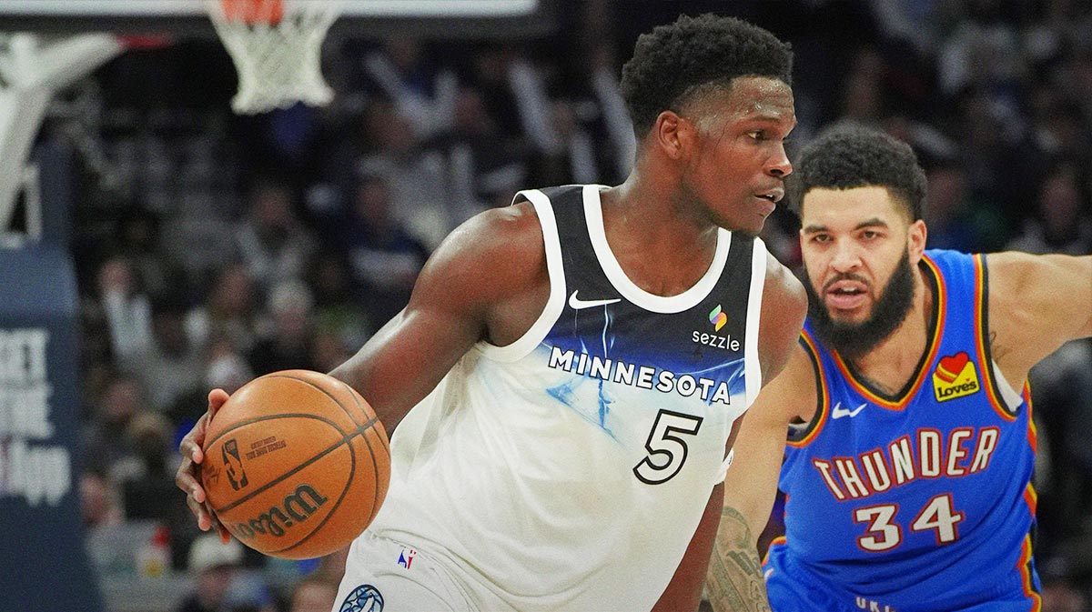 Minnesota Timberwolves guard Anthony Edwards (5) works past Oklahoma City Thunder guard Kenrich Williams (34) in the fourth quarter at Target Center. 