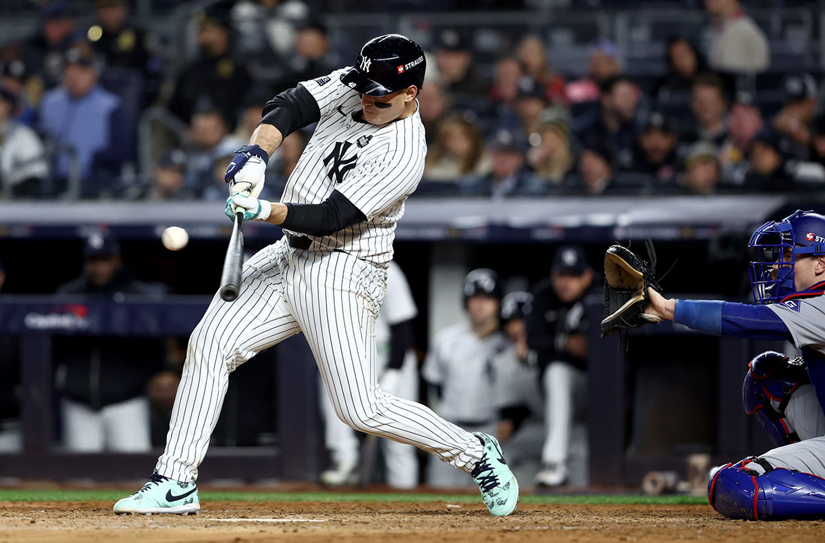 New York Yankees first baseman Anthony Rizzo (48) singles during the seventh inning against the Los Angeles Dodgers in game three of the 2024 MLB World Series at Yankee Stadium. 