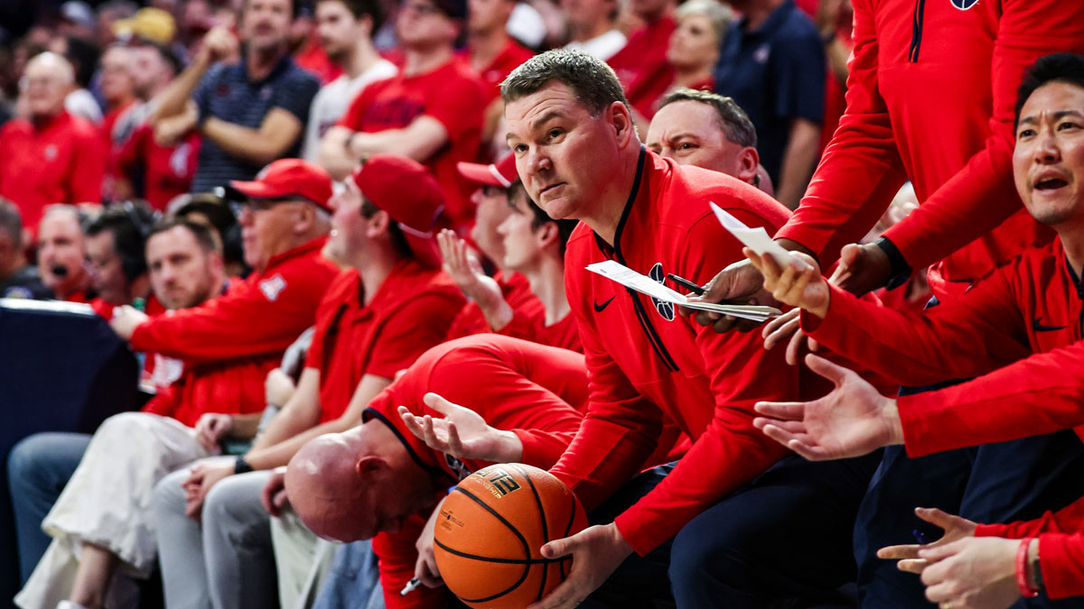 Arizona Wildcats head coach Tommy Lloyd looks at the referee after BYU Cougars guard Trey Stewart (1) threw the ball at him by accident during the second half at McKale Center.