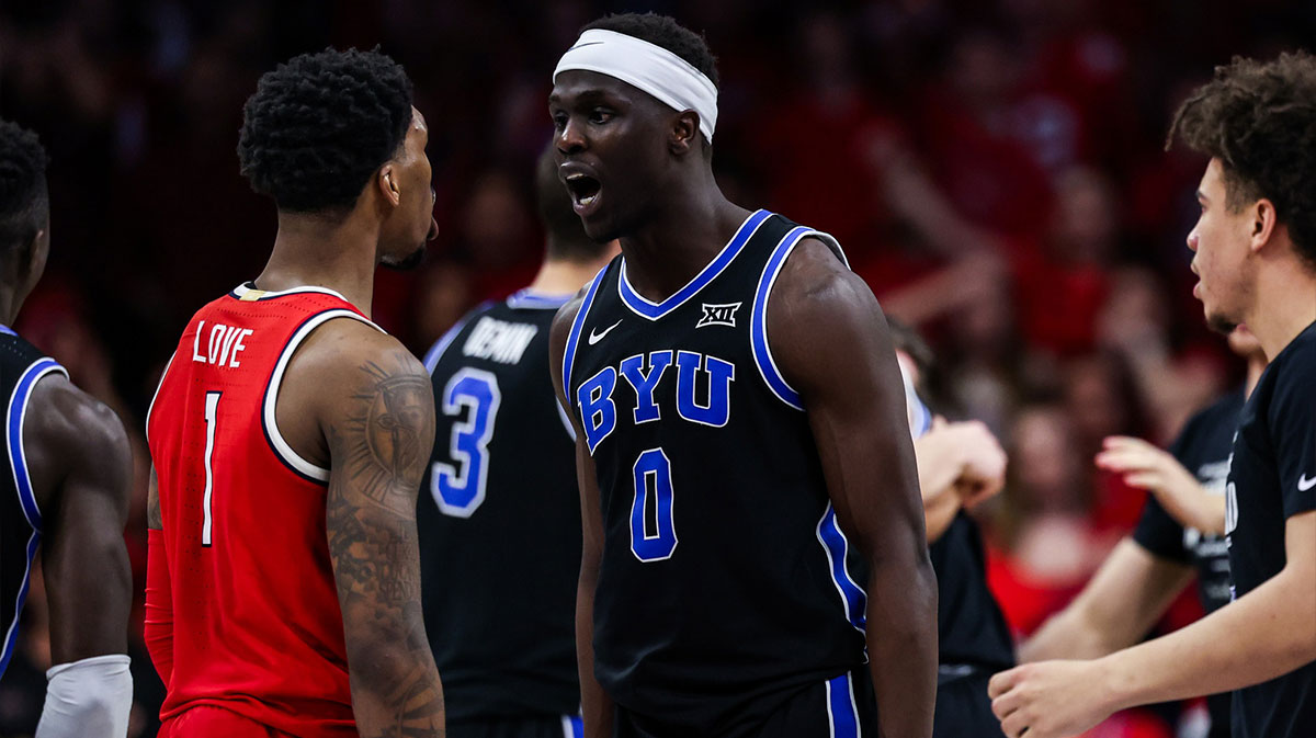 Arizona Wildcats guard Caleb Love (1) and BYU Cougars forward Mawot Mag (0) exchange words at the end of the game at McKale Center.