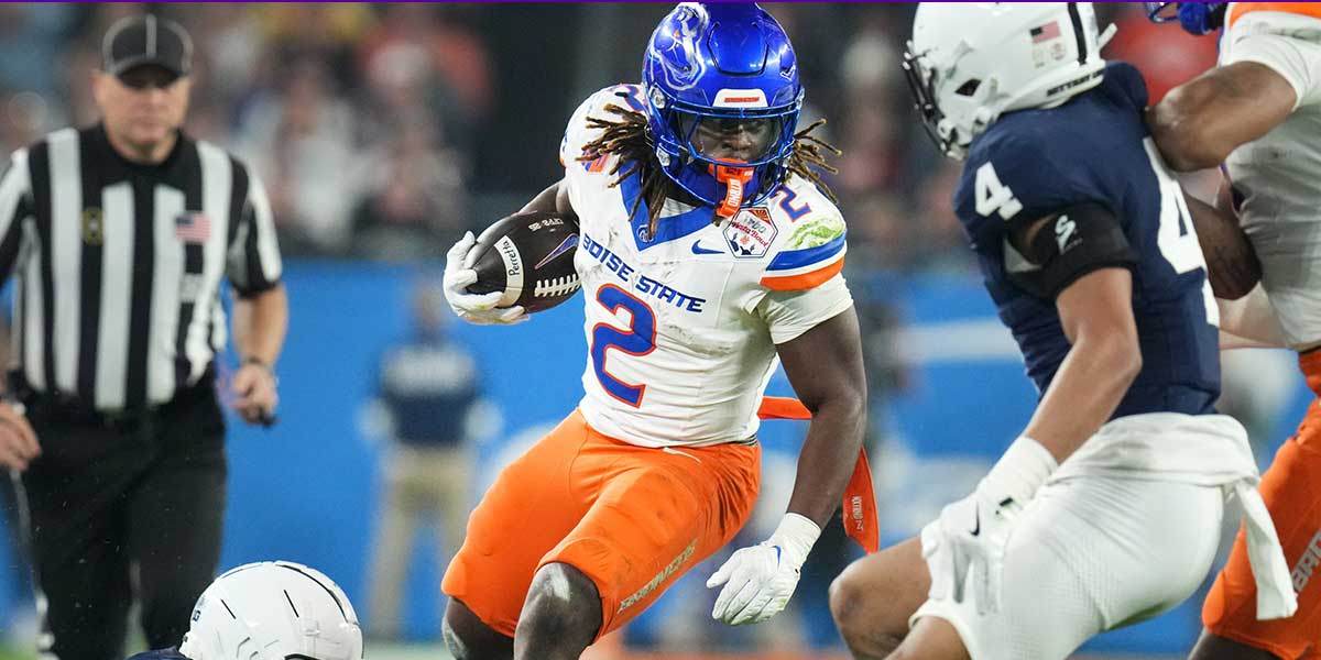 Boise State Broncos Running Back Ashton Jeanty (2) Passes Next Penn State Nittani Lions Linebacker Kobe King (41) During their Vrbo Fiesta Bowl Matchup at State Farm Stadium