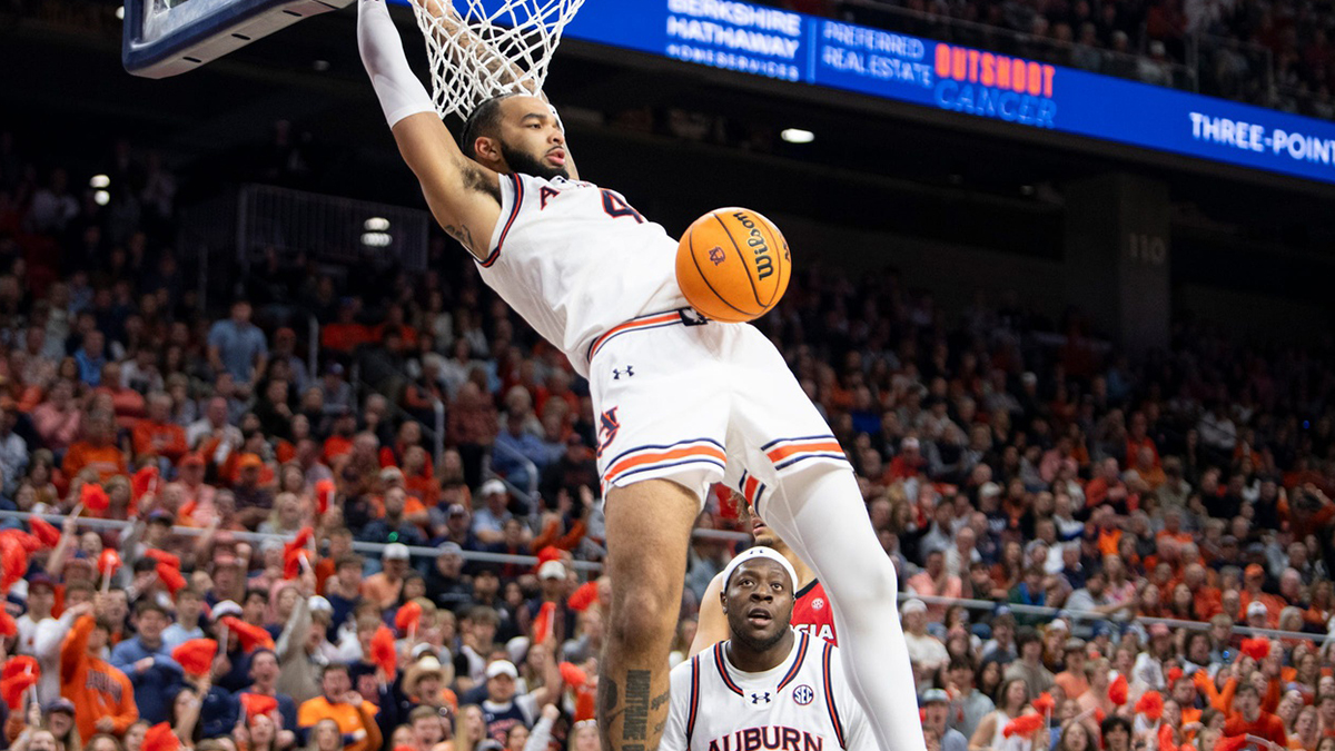 Auburn Tigers forward Johni Broome (4) dunks the ball as Auburn Tigers take on Georgia Bulldogs at Neville Arena in Auburn, Ala., on Saturday, Feb. 22, 2025. Auburn Tigers defeated Georgia Bulldogs 82-70.