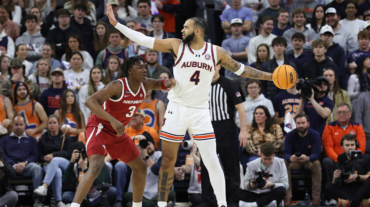 Auburn Tigers forward Johni Broome (4) looks for help as Arkansas Razorbacks forward Adou Thiero (3) defends during the firs half at Neville Arena.