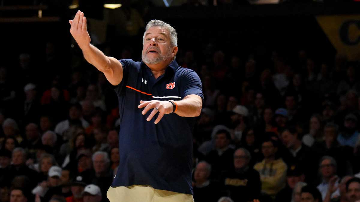Auburn basketball head coach Bruce Pearl yells to his team.