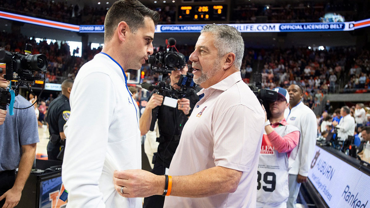 Florida Gators head coach Todd Golden and Auburn Tigers head coach Bruce Pearl talk before the game as Auburn Tigers take on Florida Gators at Neville Arena in Auburn, Ala., on Saturday, Feb. 8, 2025.