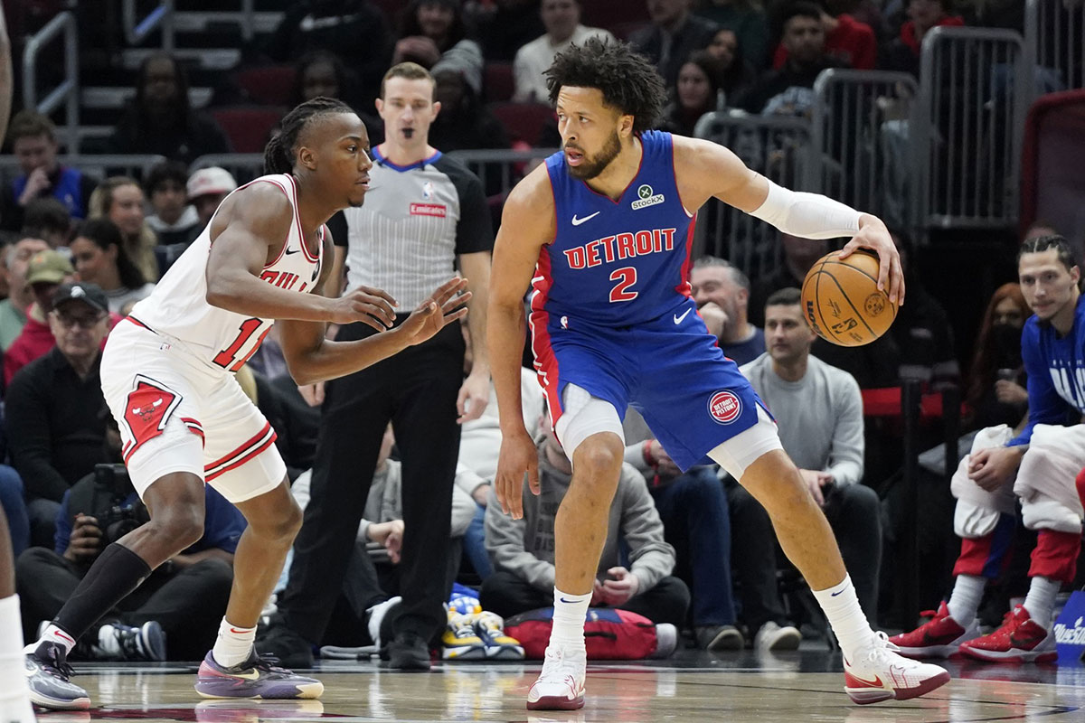 Chicago Bulls guard Ayo Dosunmu (11) defends Detroit Pistons guard Cade Cunningham (2) during the first quarter at United Center.