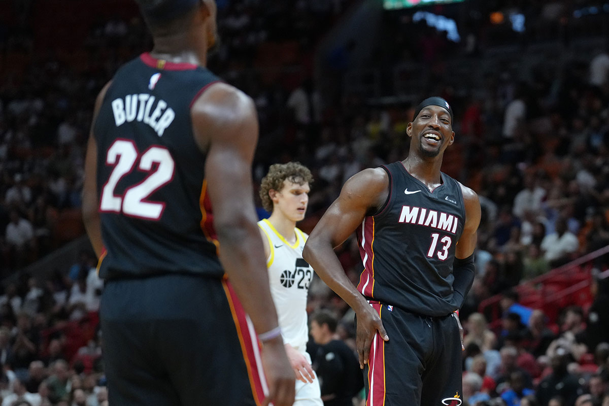 Miami Heat Center Bam Adebaiio (13) Size laughter with Miami heat forward Jimmy Butler (22) in the fourth quarter in the Cashier Center. 