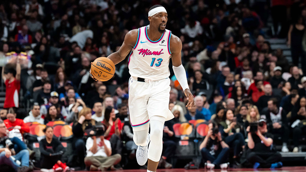 Miami Heat Center Bam Adebaiio (13) Dribblible Ball against Toronto Raptor in Scotiabank Arena.