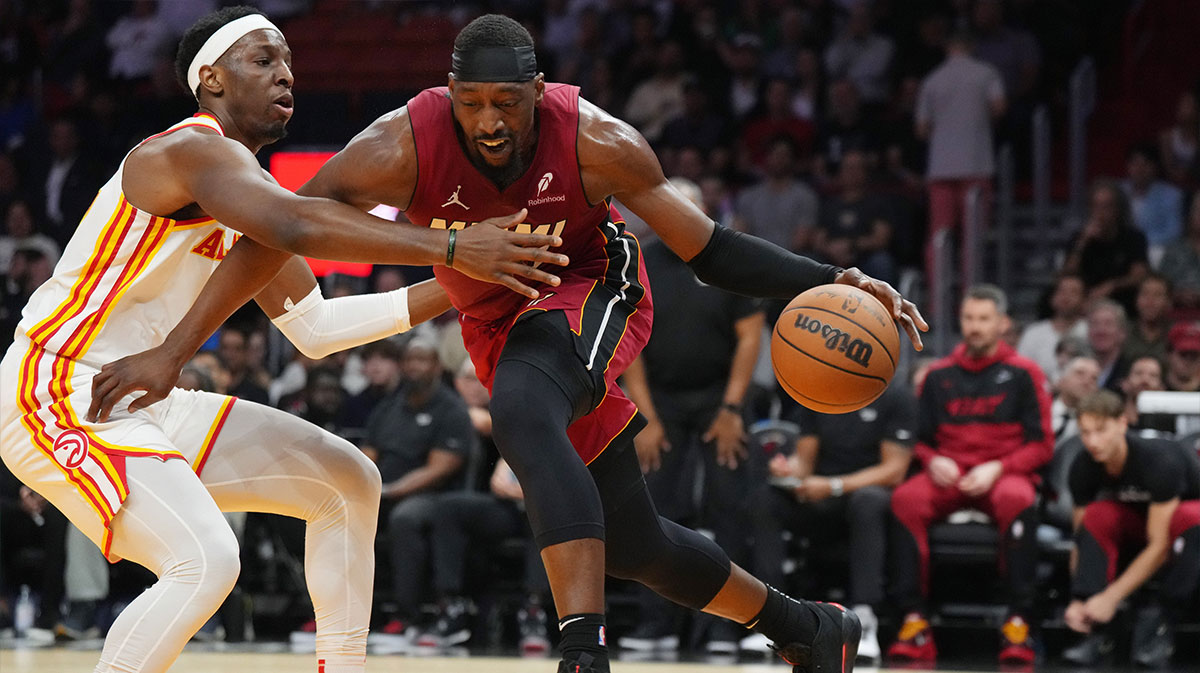 Miami Heat center Bam Adebayo (13) drives to the basket as Atlanta Hawks forward Onyeka Okongwu (17) defends in the first half at Kaseya Center.