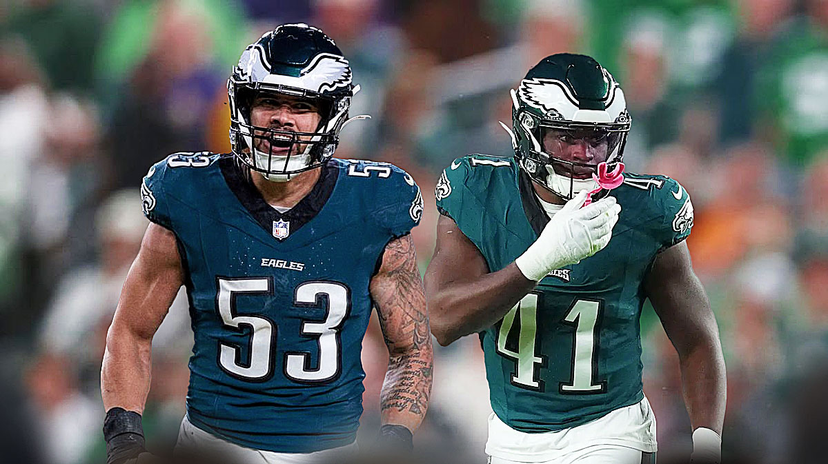 Zach Baun next to Nicholas Morrow (Eagles) in front of the Eagles stadium.