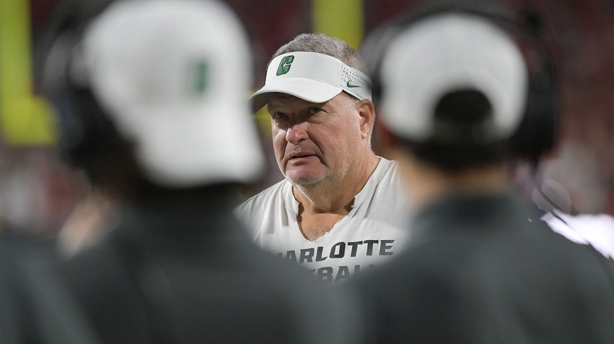Charlotte 49ers head coach Biff Poggi walks down the sidelines during the first half against the Maryland Terrapins at SECU Stadium.