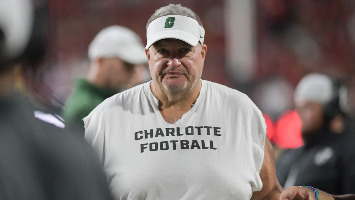 Charlotte 49ers head coach Biff Poggi walks down the sidelines during the first half against the Maryland Terrapins at SECU Stadium.