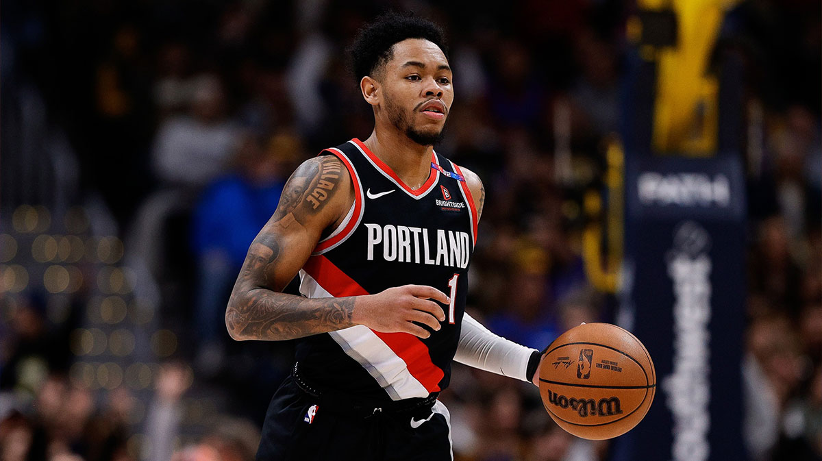 The goalkeeper of Portland Trail Blazers Anfernee Simons (1) dribbles the land in the second quarter against the Denver Nuggets in Ball Arena.