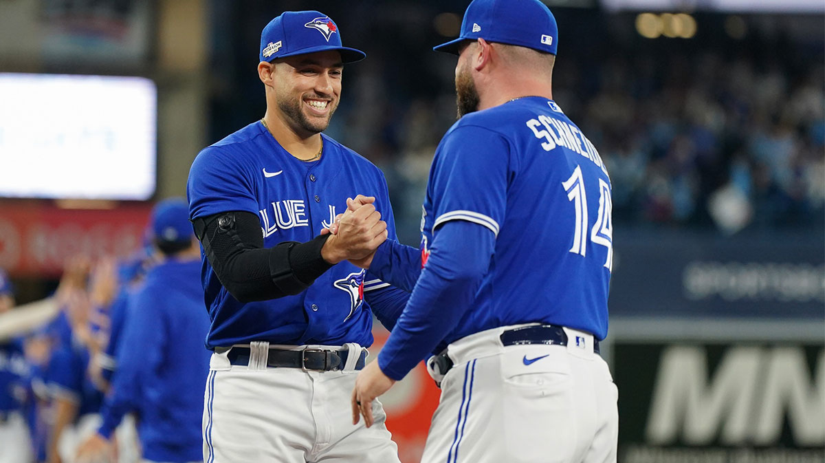 Toronto Blue Jays center fielder George Springer (4) and interim manager John Schneider (14) before the game against the Seattle Mariners in game one of the Wild Card series for the 2022 MLB Playoffs at Rogers Centre.