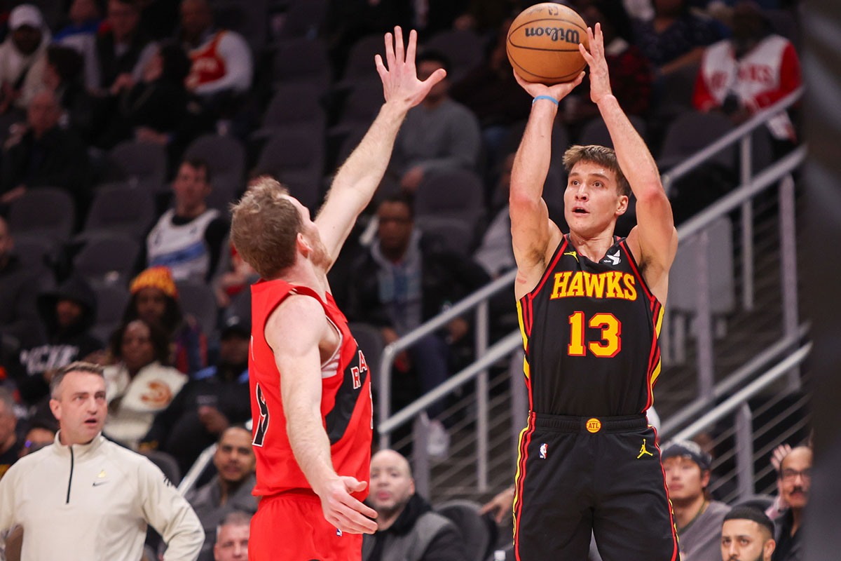 Atlanta Hawks Keeps Bogdana Bogdanovic (13) shoots against Toronto Raptor in the second quarter at the State Farm Arena. 