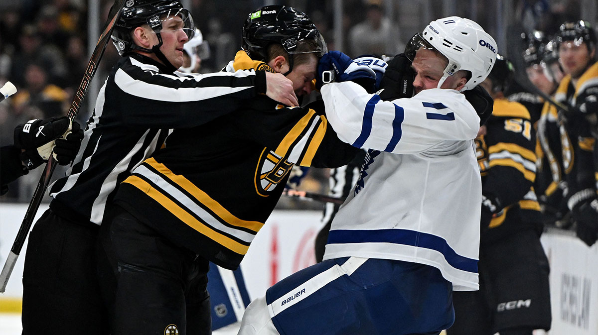 Boston Bruins center Trent Frederic (11) shoves Toronto Maple Leafs center Max Domi (11) after a whistle during the second period at the TD Garden. 