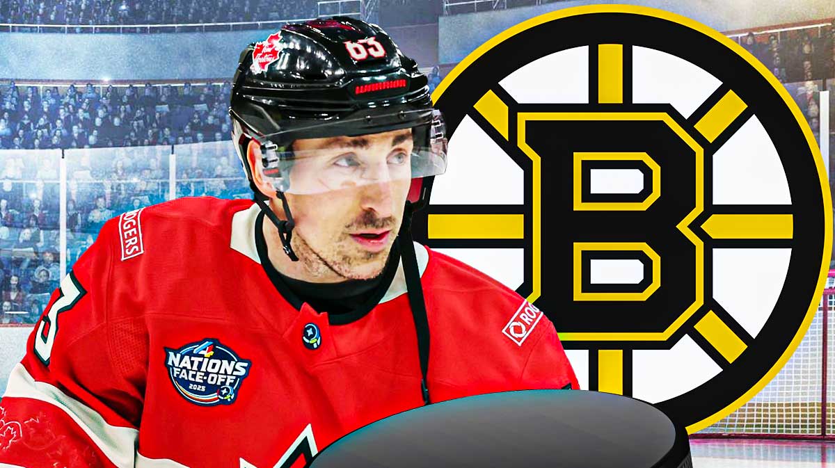 Brad Marchand looking stern, Boston Bruins logo, hockey rink in background