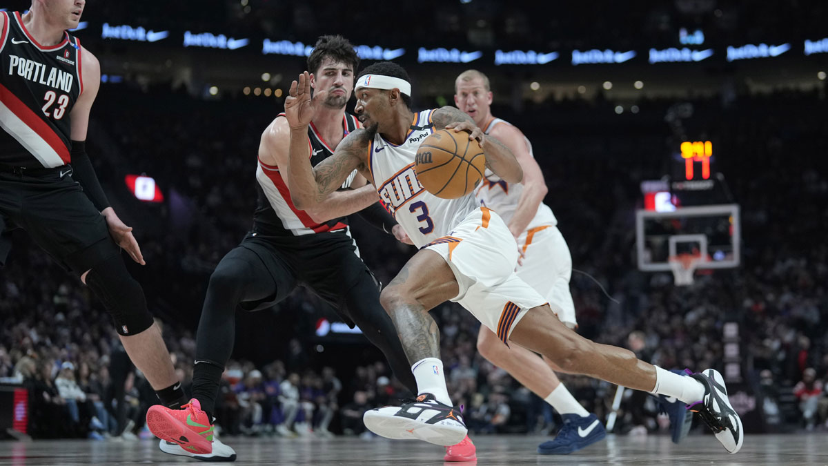 Phoenix Suns shooting guard Bradley Beal (3) dribbles the ball against Portland Trail Blazers small forward Deni Avdija (8, left) during the first half at Moda Center.