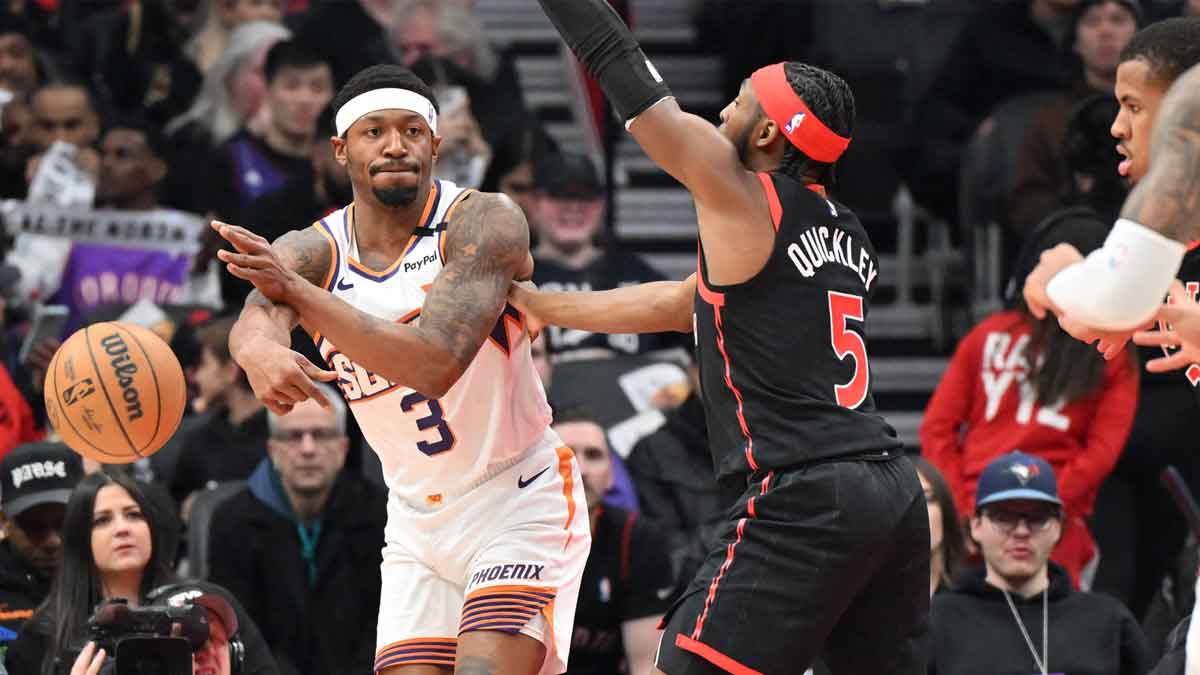 Phoenix Suns guard Bradley Beal (3) passes the ball as Toronto Raptors guard Immanuel Quickley (5) defends in the first half at Scotiabank Arena. 