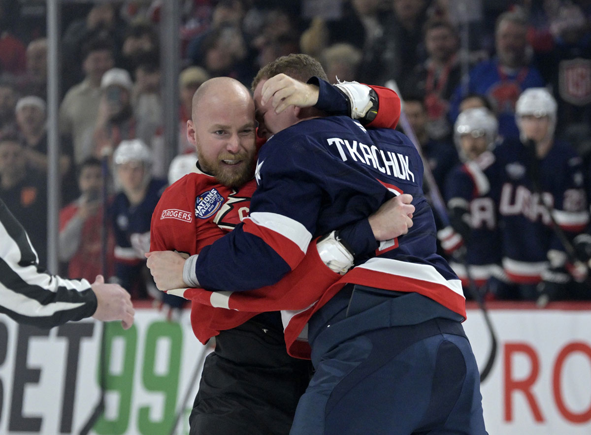 Team Canada forward Sam Bennett (9) and Team United States forward Brady Tkachuk (7) fight in the first period during a 4 Nations Face-Off ice hockey game at the Bell Centre.