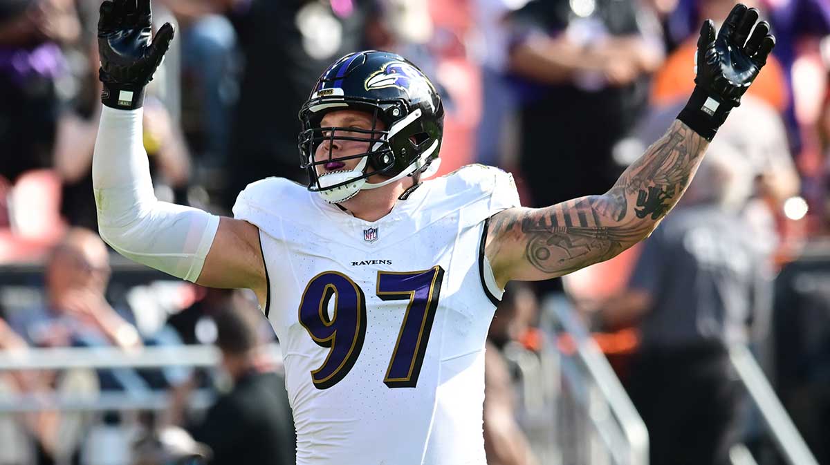 Baltimore Ravens defensive end Brent Urban (97) celebrates during the second half against the Cleveland Browns at Cleveland Browns Stadium.