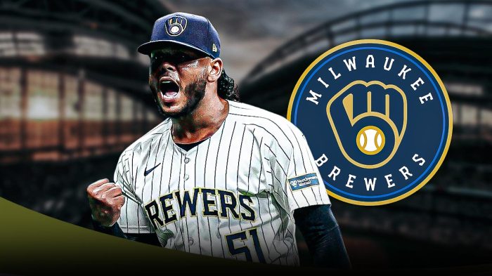 Freddy Peralta in the center with the Milwaukee Brewers logo in the background
