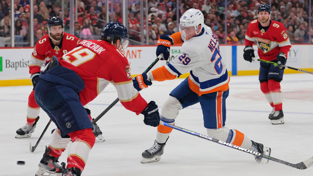 New York Islanders center Brock Nelson (29) shoots the puck as Florida Panthers left wing Matthew Tkachuk (19) defends during the first period at Amerant Bank Arena.