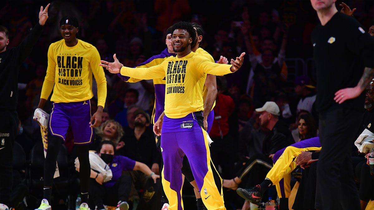 Los Angeles Lakers Guard Bronni James (9) reacts after the Lebron James (23), in the first half, achieves a three-point basket against golden state warriors during the first half at the Cripto.com Arena.