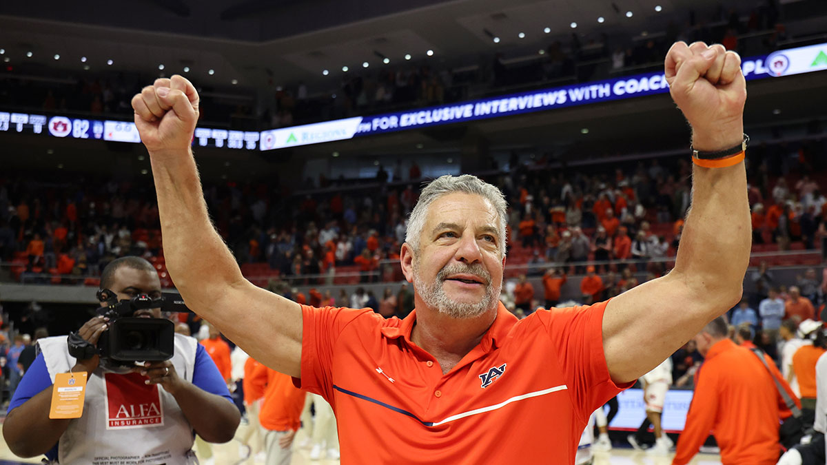 Auburn Tigers head coach Bruce Pearl celebrates the win after the game against the Georgia Bulldogs at Neville Arena.