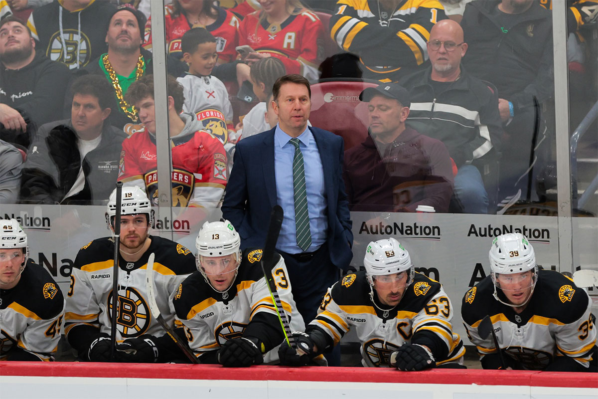 Boston Bruins interim head coach Joe Sacco watches from the bench against the Florida Panthers during the third period at Amerant Bank Arena.