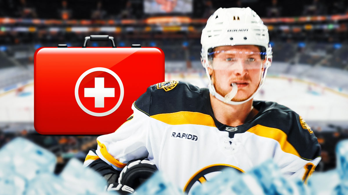 Trent Frederic looking stern with first aid kit in image, TD Garden in background