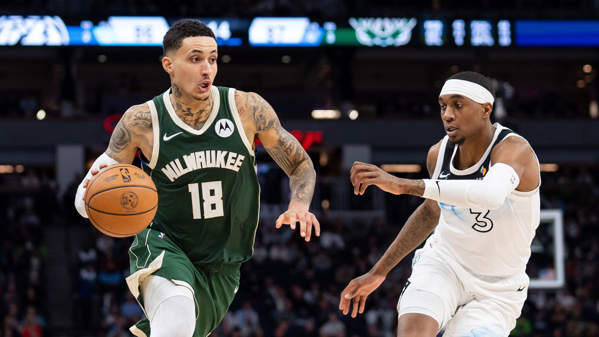 Bucks forward Kyle Kuzma (18) dribbles against Minnesota Timberwolves forward Jaden McDaniels (3) in the fourth quarter at Target Center