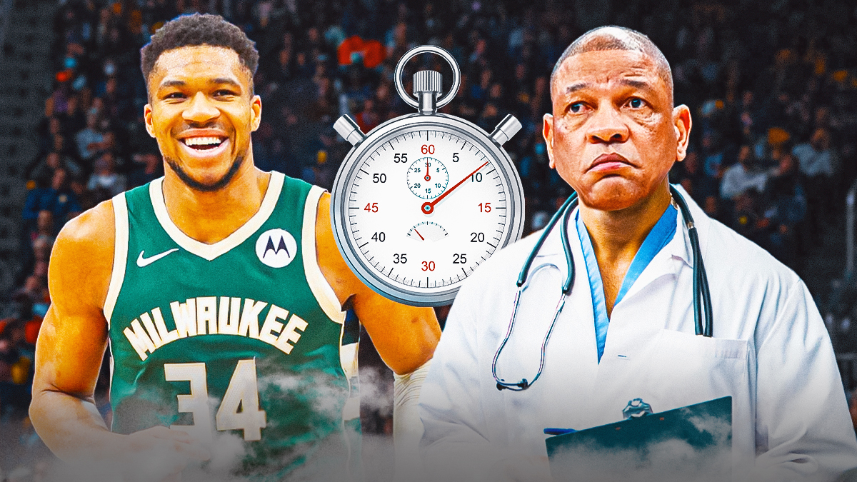 Bucks' Giannis Antetokounmpo laughing, with Doc Rivers dressed as a real doctor while holding a clipboard and a stopwatch beside him