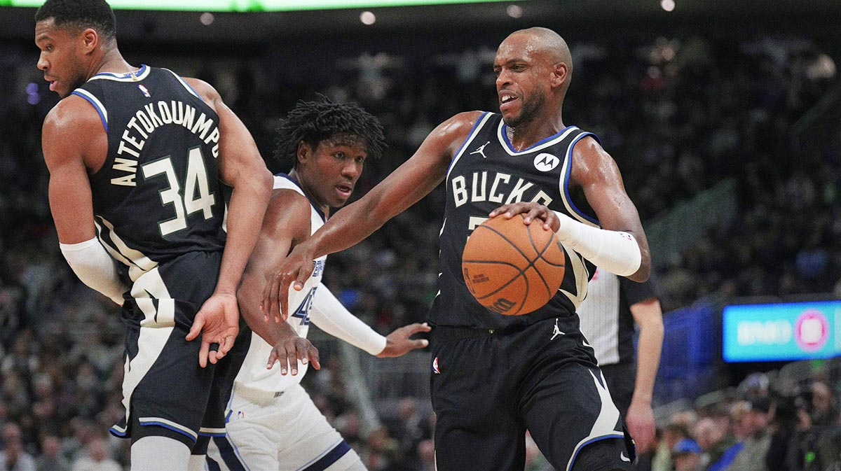 Khris Middleton (22) Drive around which set Millwaukee Bucks forward Giannis Antetokounpus (34) in the first half against Memphis Grizzlies forward GG Jackson (45) in the first half at Fiserv Forum