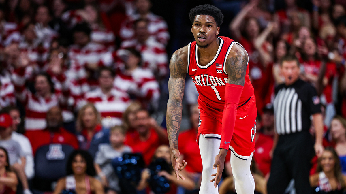Feb 22, 2025; Tucson, Arizona, USA; Arizona Wildcats guard Caleb Love (1) holds out a three after he makes a three-point basket during the first half against the BYU Cougars at McKale Center.
