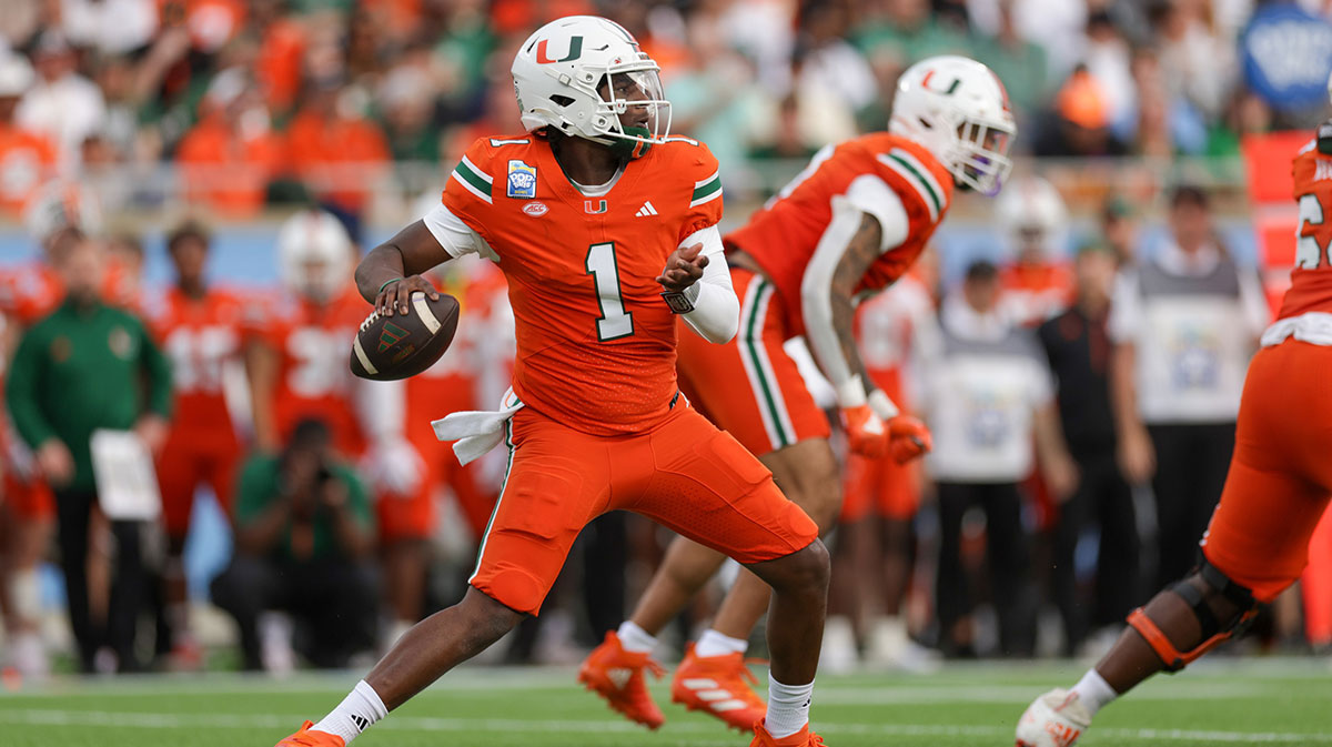 Miami Hurricanes Quarterback Cam Ward (1) fall back to pass against state cyclones Iowa in the first quarter during Pop Tarts Bowl in the camping stadium.