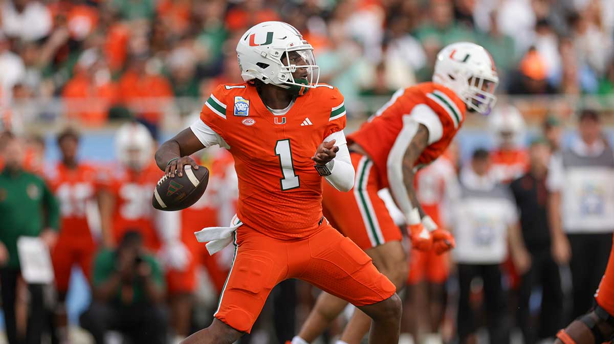 Miami Hurricanes quarterback Cam Ward (1) drops back to pass against the Iowa State Cyclones in the first quarter during the Pop Tarts bowl at Camping World Stadium. 