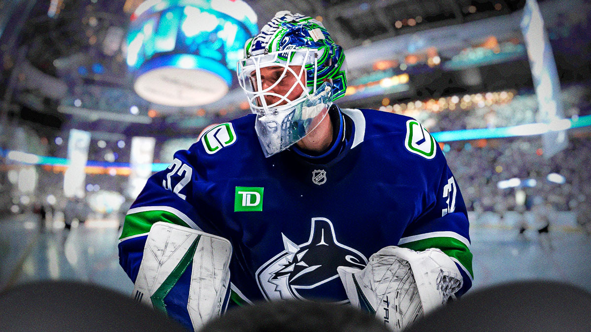 Kevin Lankinen with Canucks on right.