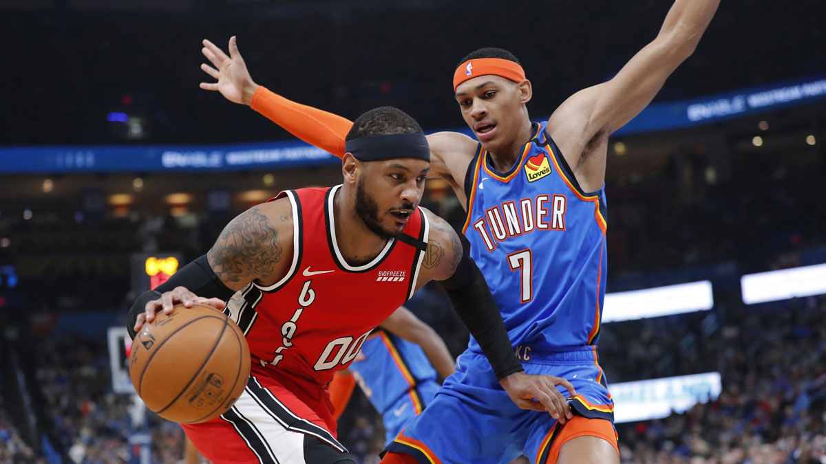 Portland Trail Blazers forward Carmelo Anthony (00) drives to the basket against Oklahoma City Thunder forward Darius Bazley (7) during the first quarter at Chesapeake Energy Arena.